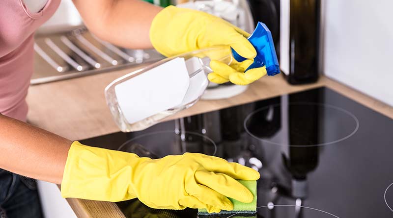 cleaning a kitchen hob