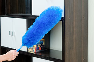 feather duster on a cupboard