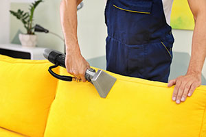 bright yellow couch with cleaner